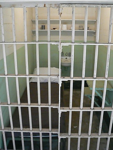 Prison cell with bed inside Alcatraz main building san francisco california