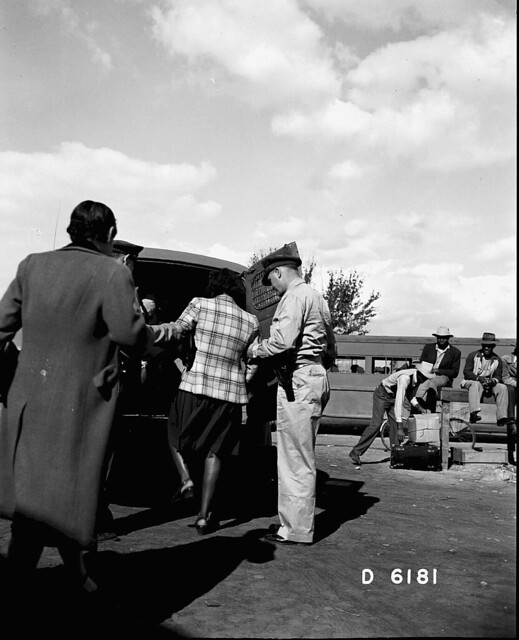 Patrol Men Putting Woman in Paddy Wagon