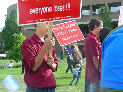 Kids from Aurora, Colorado on a youth mission to Anchorage being bused to the Loussac by ABT to wave signs printed by Jim Minnery's Alaska Family Council during public hearings on AO-64, the Anchorage Equal Rights Ordinance, in 2009.
