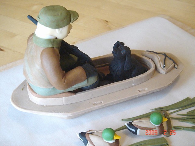 Duck hunting cake topper The dog is raising his right ear to listen to what