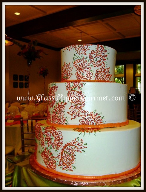 Anne and Sunil chose a vibrant orange rust red and green color scheme for 