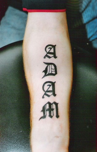 name tattoo in gothic letters on forearm by dublin ireland tattoo artist 