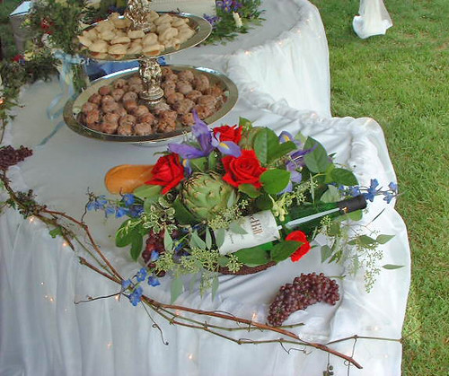 Wedding buffet table flowers by Beikmann Associates