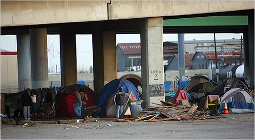 Tents under an overpass in a Fresno, California rail yard. Homelessness in Fresno has long been fed by the ups and downs in seasonal and subsistence jobs in agriculture, but the recession has cast a wider net and drawn hundreds of newly homeless. by Pan-African News Wire File Photos