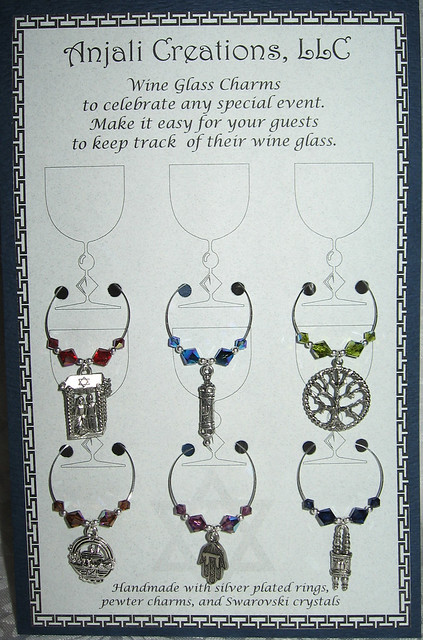 This is a boxed set of six Judaic wedding themed wine charms