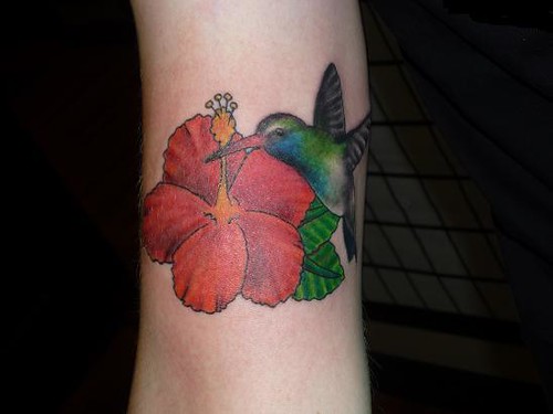 Hibiscus and hummingbird tattoo by Lucky Bamboo Tattoo