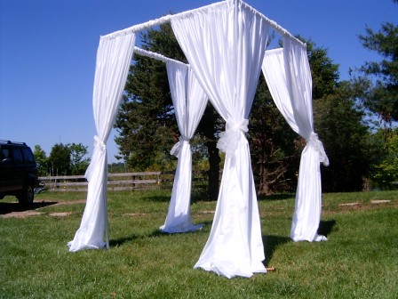 Canopy of white fabric for wedding ceremony Would look great in a circle of