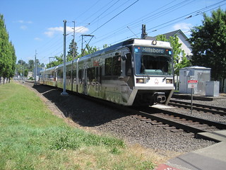 A Hillsboro-bound interurban approaches from the east