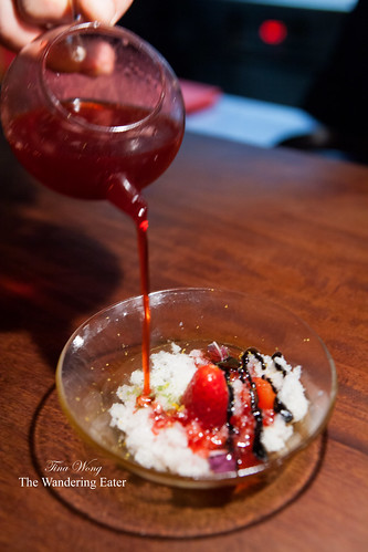 Course 15 - (Dessert) Pouring strawberry sauce on top of the lychee ice, strawberries, black garlic, shiso