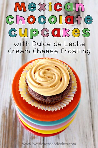 Mexican Chocolate Cupcakes with Dulce de Leche Cream Cheese Frosting. Cupcake on top of a stack of plates. 