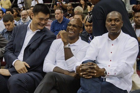 July 13, 2013 - Yao Ming shares a laugh with Clyde Drexler at the Dwight Howard press conference