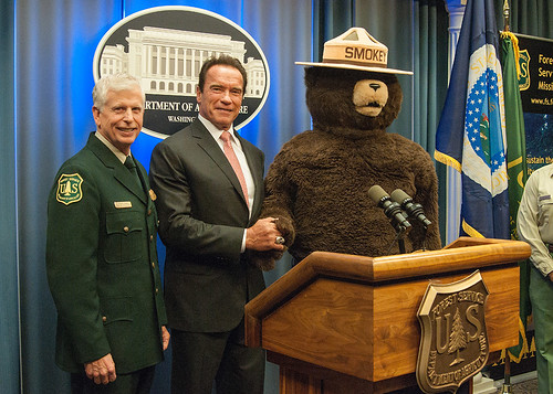 (left to right) Chief Tom Tidwell, former Governor Arnold Schwarzenegger and Smokey Bear at today’s ceremony. (Photo by Bob Nichols, USDA)