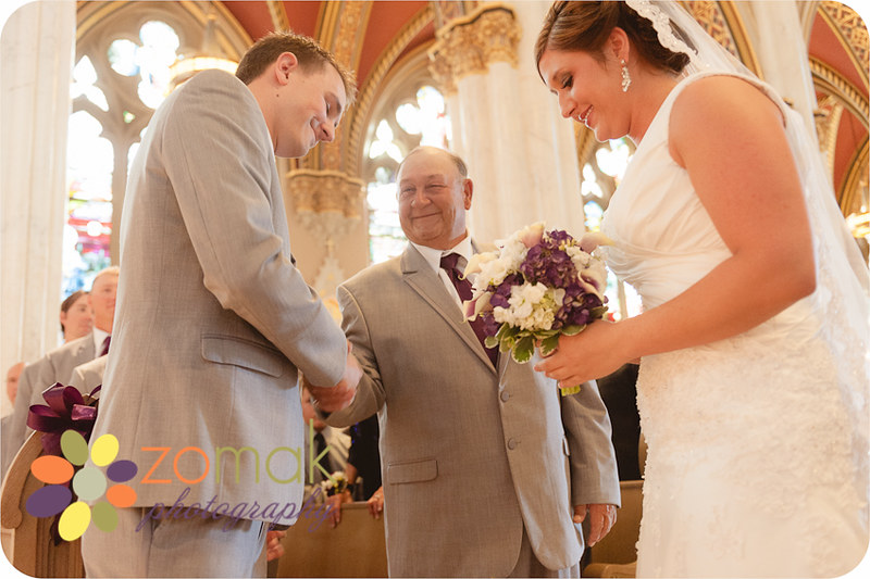 Father of the bride gives his daughter to her groom at the st helena cathedral in helena montana