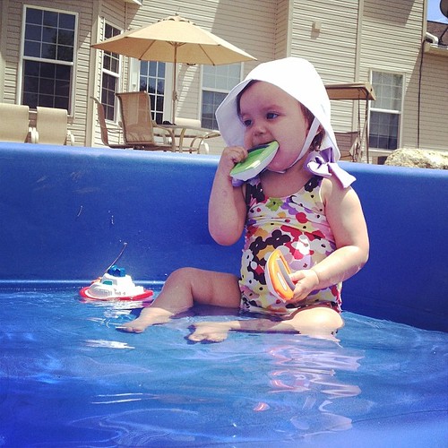 Pool day! Jameson's at the kiddie pool while this teething lady hangs poolside at home