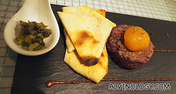 Skyve Beef Tatare – Truffle egg yolk, cilantro, flat bread, ancho chilli aioli, thyme sea salt (S$22)