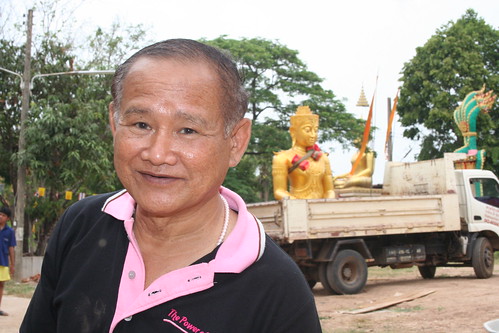 Committee member supervising Buddha transport in temple Wat Luang 16 04 2013. by tGenteneeRke langs de Mekong