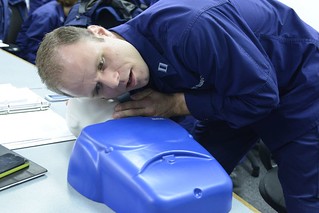 Lt. Joseph Prado, a Enforcement Division member at the 8th Coast Guard District, performs CPR on a training dummy as part of an exercise at Coast Guard Station New Orleans, Dec. 9, 2013. The primary objective of the boat crew college is to enable personnel within the 8th District area of responsibility to get the Coast Guard Boatcrew qualification. (U.S. Coast Guard photo by Petty Officer 3rd Class Carlos Vega.)