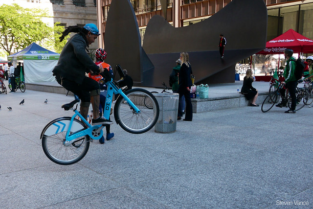 doing tricks on Divvy at Bike to Work Day Rally