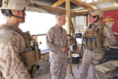Commandant Gen. Jim Amos, visits the U.S. embassy compound in Tripoli, Libya, on June 16, 2013. He is speaking with a member of 4th Force Reconnaissance Company. by Pan-African News Wire File Photos