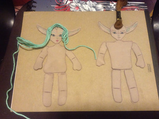 Dolls cut out, painted and ready to be sewn and stuffed.