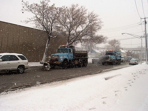 Two City of Chicago Department of Streets and Sanitation snowplow trucks at work during a snowstorm.  Chicago Illinois. December 1st, 2006. by Eddie from Chicago