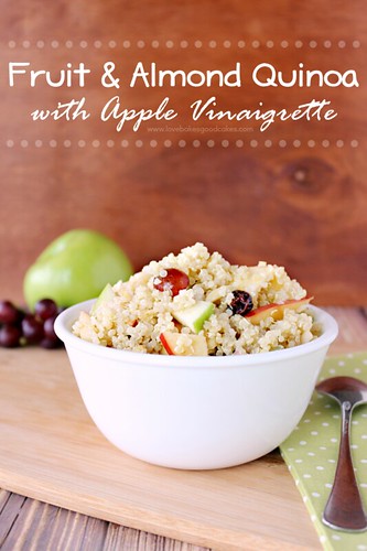 Fruit and Almond Quinoa with Apple Vinaigrette in white bowl with spoon.