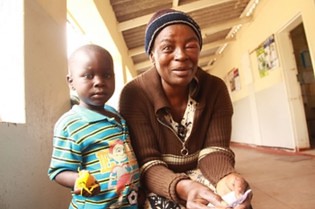 Mrs Patricia Manjeya and her grandson in a Manicaland hospital receiving treatment after an anthrax outbreak in Makoni, Zimbabwe. 33 have been affected by the disease after eating infected cattle. by Pan-African News Wire File Photos