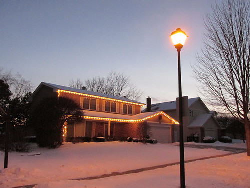 Outdoor Christmas holiday lights turned on at twilight.  Palatine Illinois.  December 2013. by Eddie from Chicago