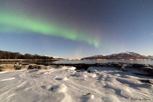 Jan 20. 2014 Stamnes, Sortland in Norway. Around –10 degree C cold. Aurora over iced rocks.