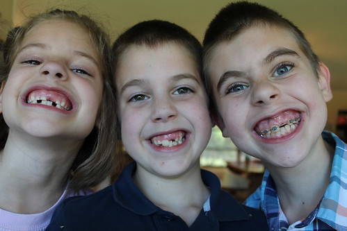 All three big kids with the same missing top left tooth :)