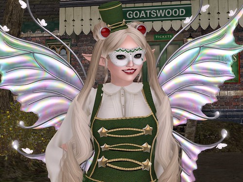Deoridhe, dressed as above, standing in front of the Goatswood Train station and smiling.