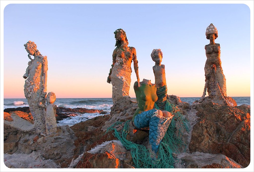 mermaid statues at sunset punta del este