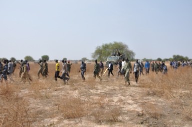 SPLM delegation with Ugandan forces in Bor County, Jonglei state. They were there to investigate an alleged massacre of civilians. by Pan-African News Wire File Photos