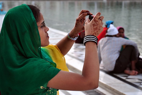 India - Punjab - Amritsar - Golden Temple - Young Woman Taking Picture