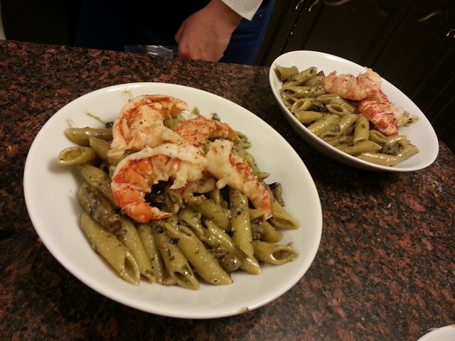 pasta with portobello and pesto cream sauce, topped with lobster tails