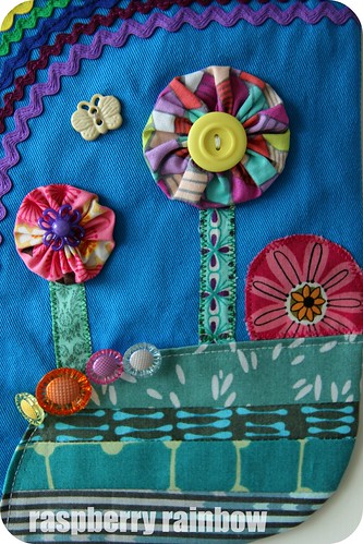 YoYo fabric trees, button flowers, quilted grass.
