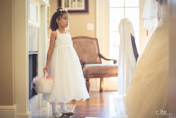 Flower-girl-looking-up-at-bride