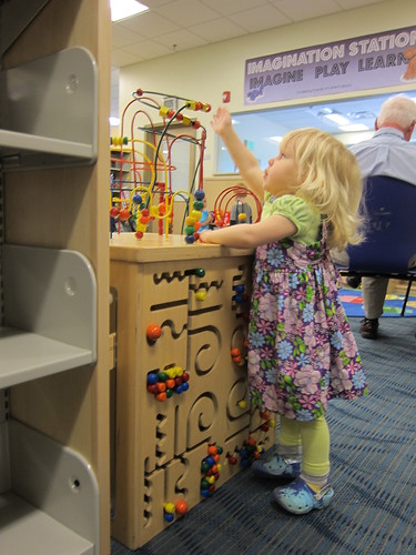 Playing with the bead maze at the new library