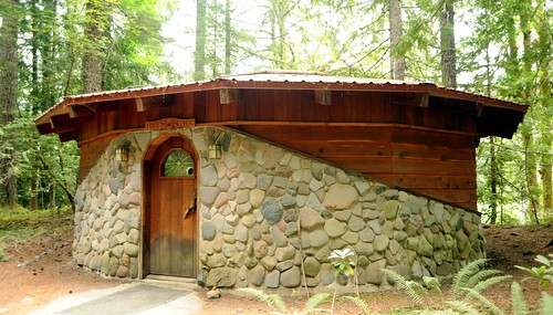 Forest sheder, wood and stone round building, arch door, stained glass, forest, Breightenbush Hot Springs, Marion County, Oregon, USA by Wonderlane