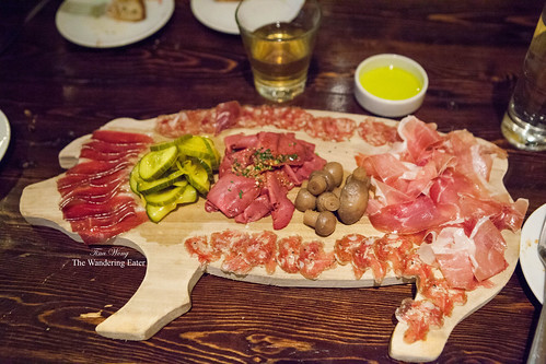 Charcuterie on a wooden pig-shaped tray