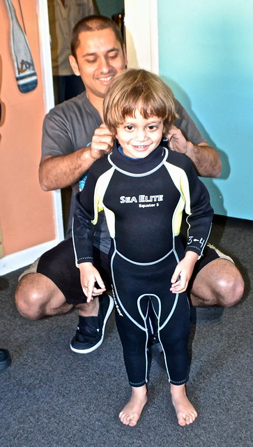 baby in wetsuit ready to swim with manatees in florida