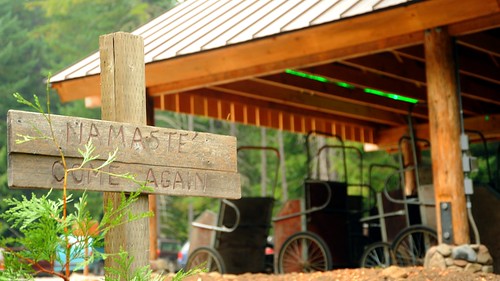 NAMASTE', COME AGAIN, sign, carts in new log and wood shed, Breightenbush Hot Springs, Marion County, Oregon, USA by Wonderlane