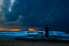 fisherman, sunset & storm