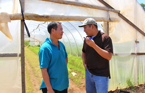 New Jersey farmer Liang Shao Hua listens to NRCS technical advisor Frank Wu provide advice in Chinese Mandarin, Liang’s native language. His limited English proficiency restricted his exposure to USDA farm programs until Tropical Storm Sandy made it necessary for Liang to connect with the department for assistance. He is now an FSA loan recipient and appreciates the cost-share benefits of the Emergency Conservation Program funds that assisted his family’s clean-up efforts.