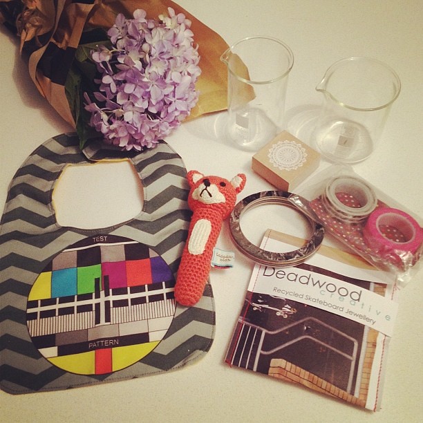 Finders Keepers goodies! Bubba's first rattle (thanks to @paravent) by Ladedah Kids, Test Pattern bib by @curlypops, Deadwood Creative recycled skateboard bangles (one for me and one for @noniponyhappy for Christmas), washi tape from @rabbitandtheduck, do