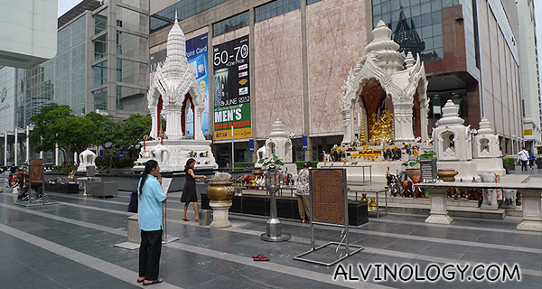 Devotees praying to the famous Buddha statue outside Central World