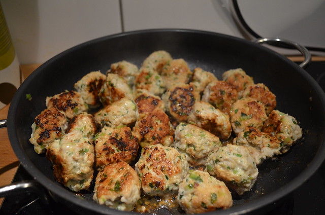 green curry thai turkey meatballs cooking in pan