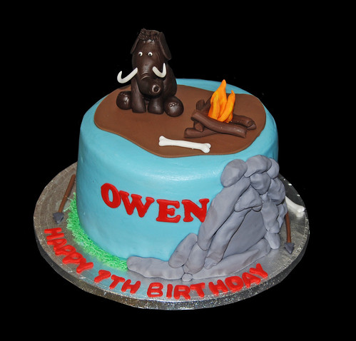 Caveman and Mammoth themed birthday cake for a Ice Age themed celebration