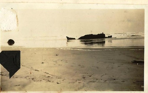 A shipwreck? Possibly on the Washington State  coast. No info on photo. by 912greens
