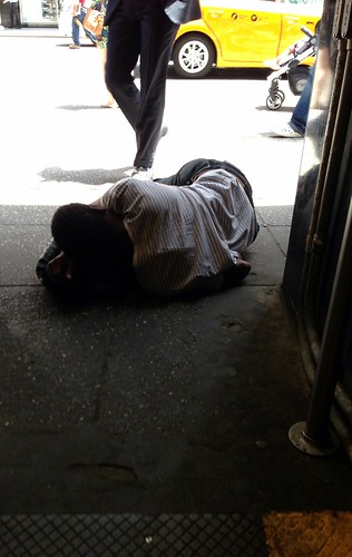Asleep in the subway entrance, Midtown